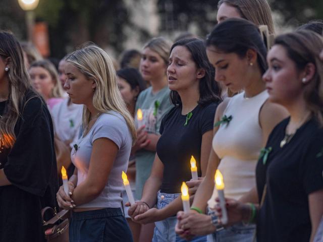 Students sing "Amazing Grace" during a vigil at the University of Texas in Austin to honor flooding victims, July 8, 2025. (Mikala Compton/Austin American-Statesman/Statesman.com/ via AP)